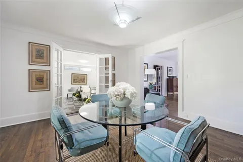 a dining room with furniture and wooden floor