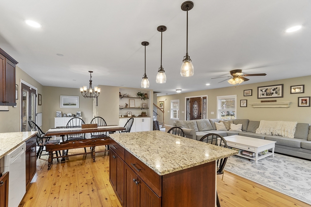 a living room with furniture a dining table and chairs