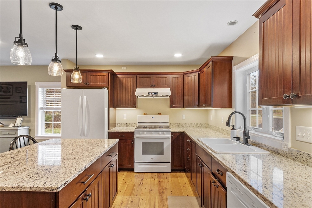 90 South Road Pepperell, MA 01463 - Photo 11 of 41 a kitchen with stainless steel appliances granite countertop a sink stove and refrigerator