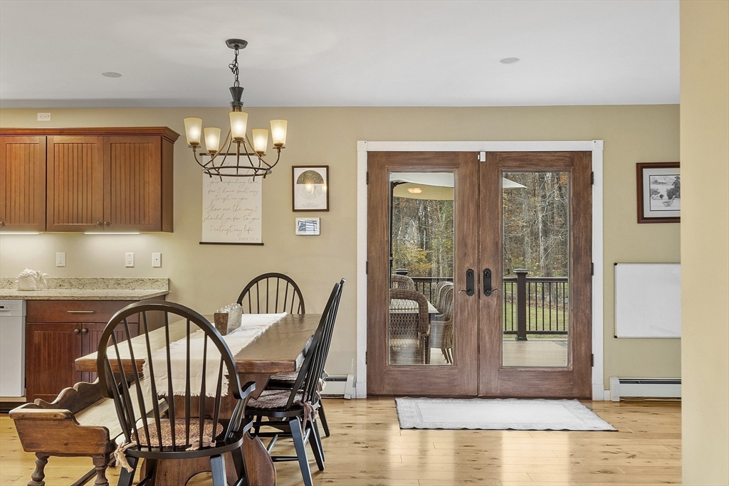 90 South Road Pepperell, MA 01463 - Photo 12 of 41 a view of a dining room with furniture and chandelier