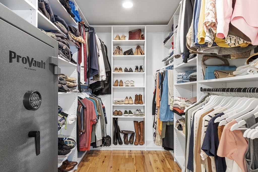 90 South Road Pepperell, MA 01463 - Photo 18 of 41 a view of walk in closet with clothes and shoes