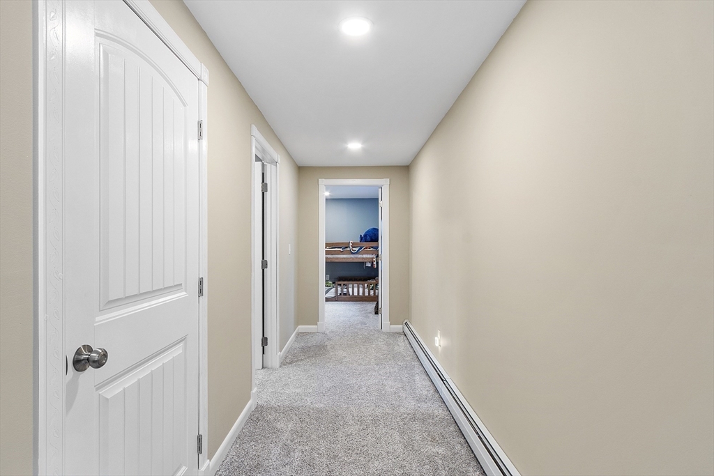 90 South Road Pepperell, MA 01463 - Photo 20 of 41 a view of a hallway with wooden shelves