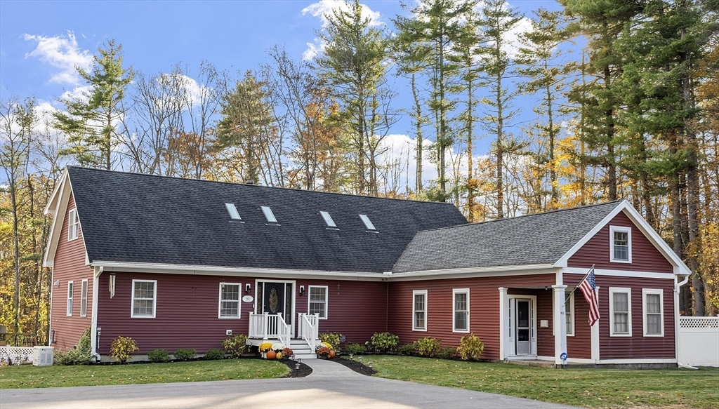 90 South Road Pepperell, MA 01463 - Photo 2 of 41 a front view of a house with garden