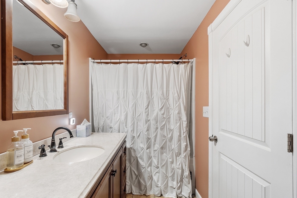 90 South Road Pepperell, MA 01463 - Photo 25 of 41 a bathroom with a granite countertop sink and a mirror