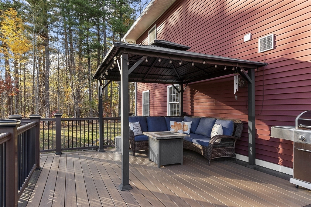 90 South Road Pepperell, MA 01463 - Photo 31 of 41 a patio with wooden floors and furniture