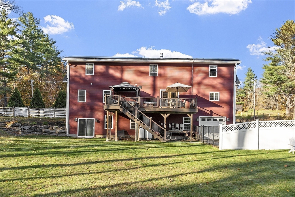 90 South Road Pepperell, MA 01463 - Photo 32 of 41 a front view of a house with a yard table and chairs