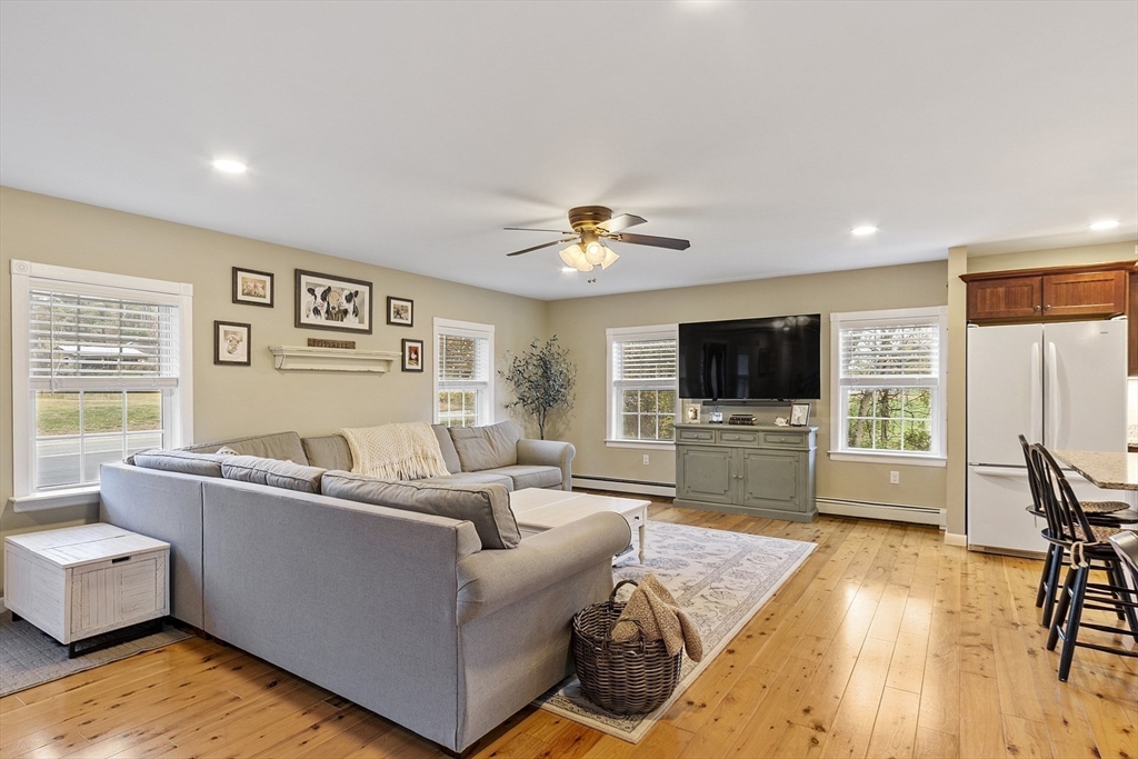 90 South Road Pepperell, MA 01463 - Photo 7 of 41 a living room with furniture and a flat screen tv