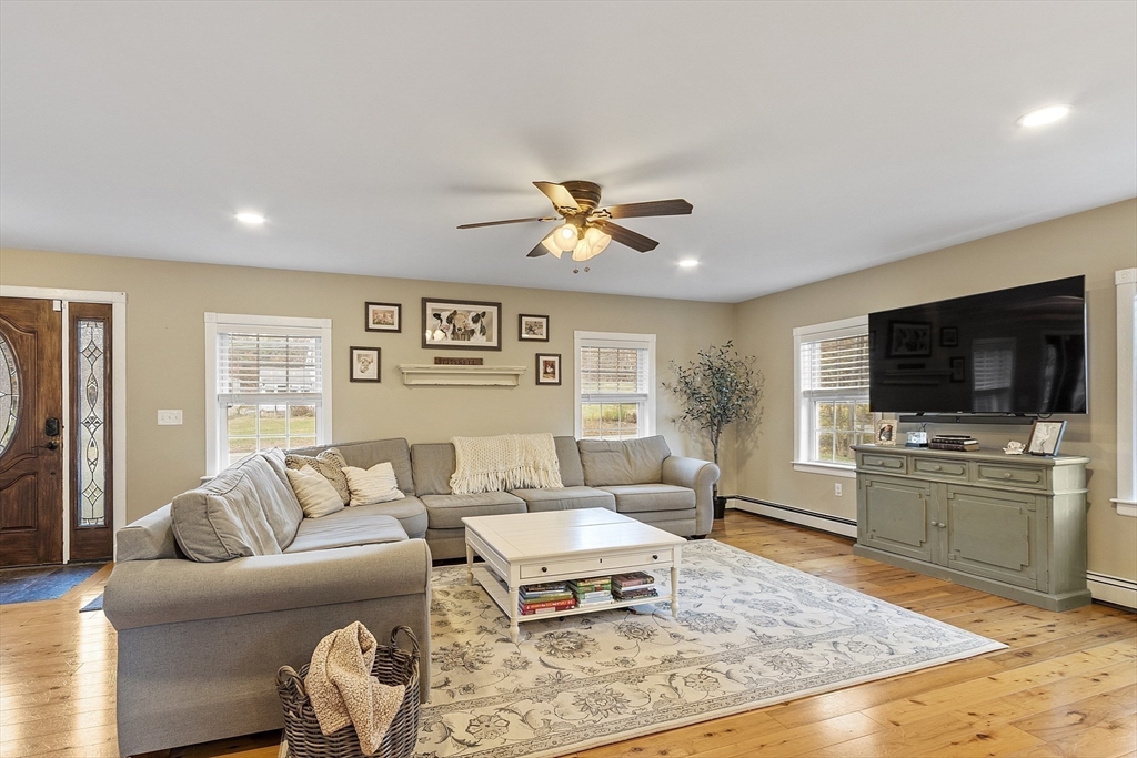 90 South Road Pepperell, MA 01463 - Photo 9 of 41 a living room with furniture flat screen tv and window