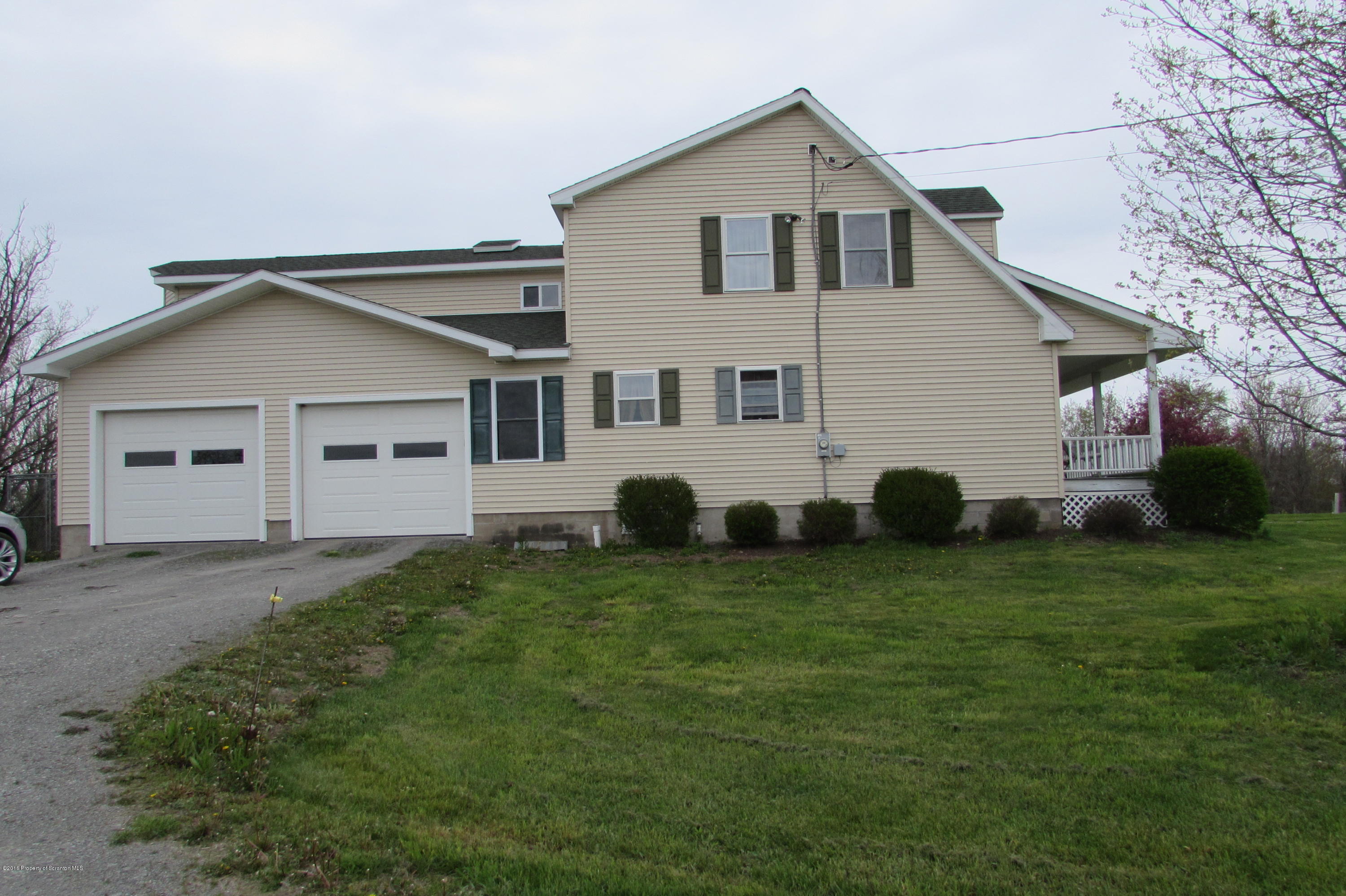637 Craig Hill Road Meshoppen, PA 18630 - Photo 14 of 22 a front view of a house with a garden