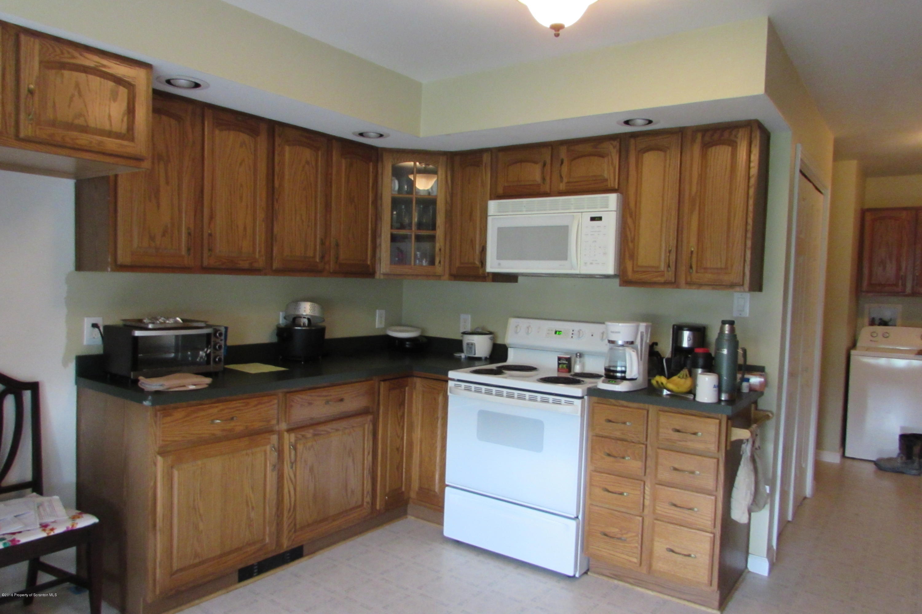 637 Craig Hill Road Meshoppen, PA 18630 - Photo 2 of 22 a kitchen with stainless steel appliances granite countertop a sink stove and cabinets