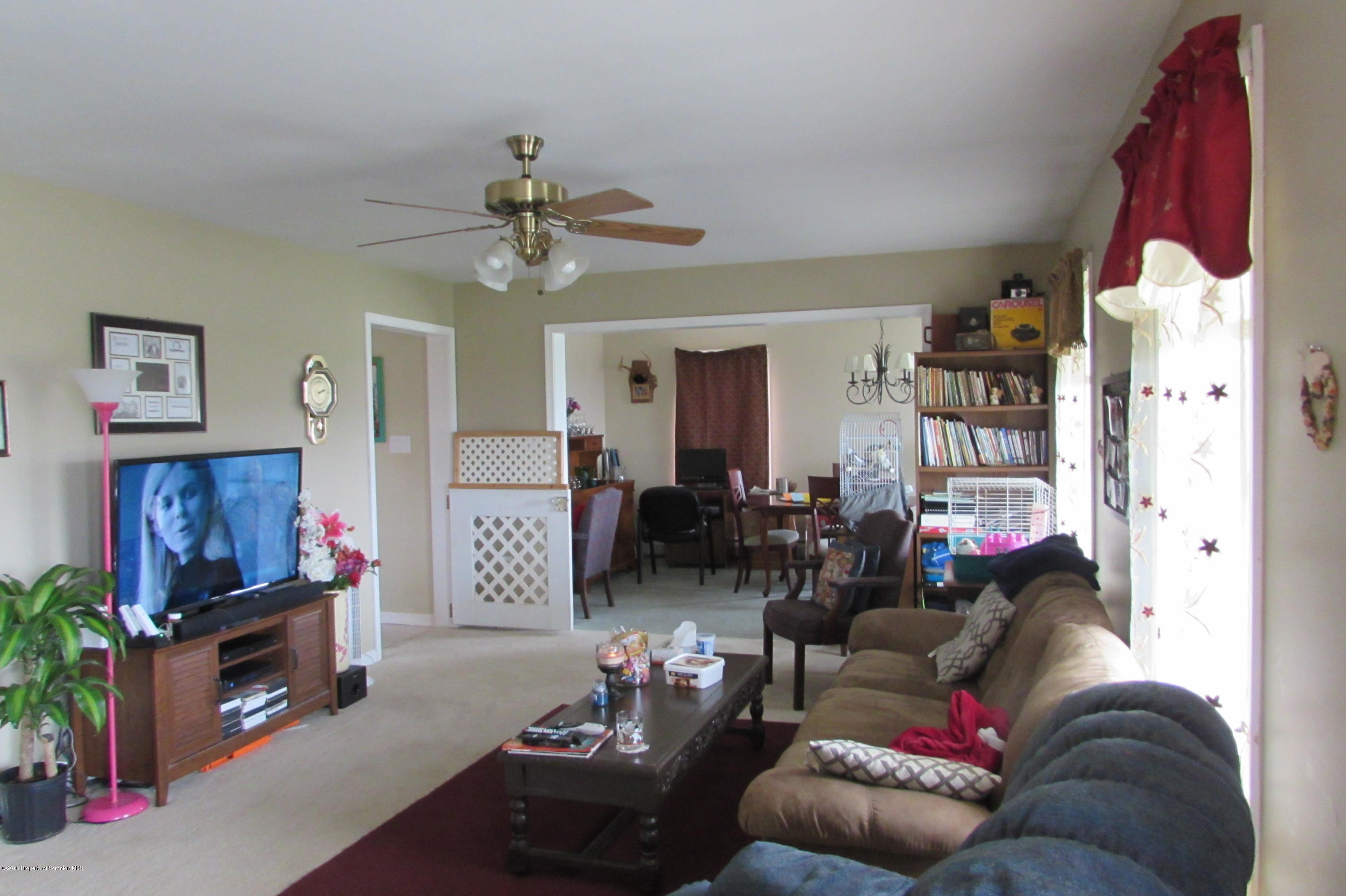 637 Craig Hill Road Meshoppen, PA 18630 - Photo 4 of 22 a living room with furniture and a flat screen tv