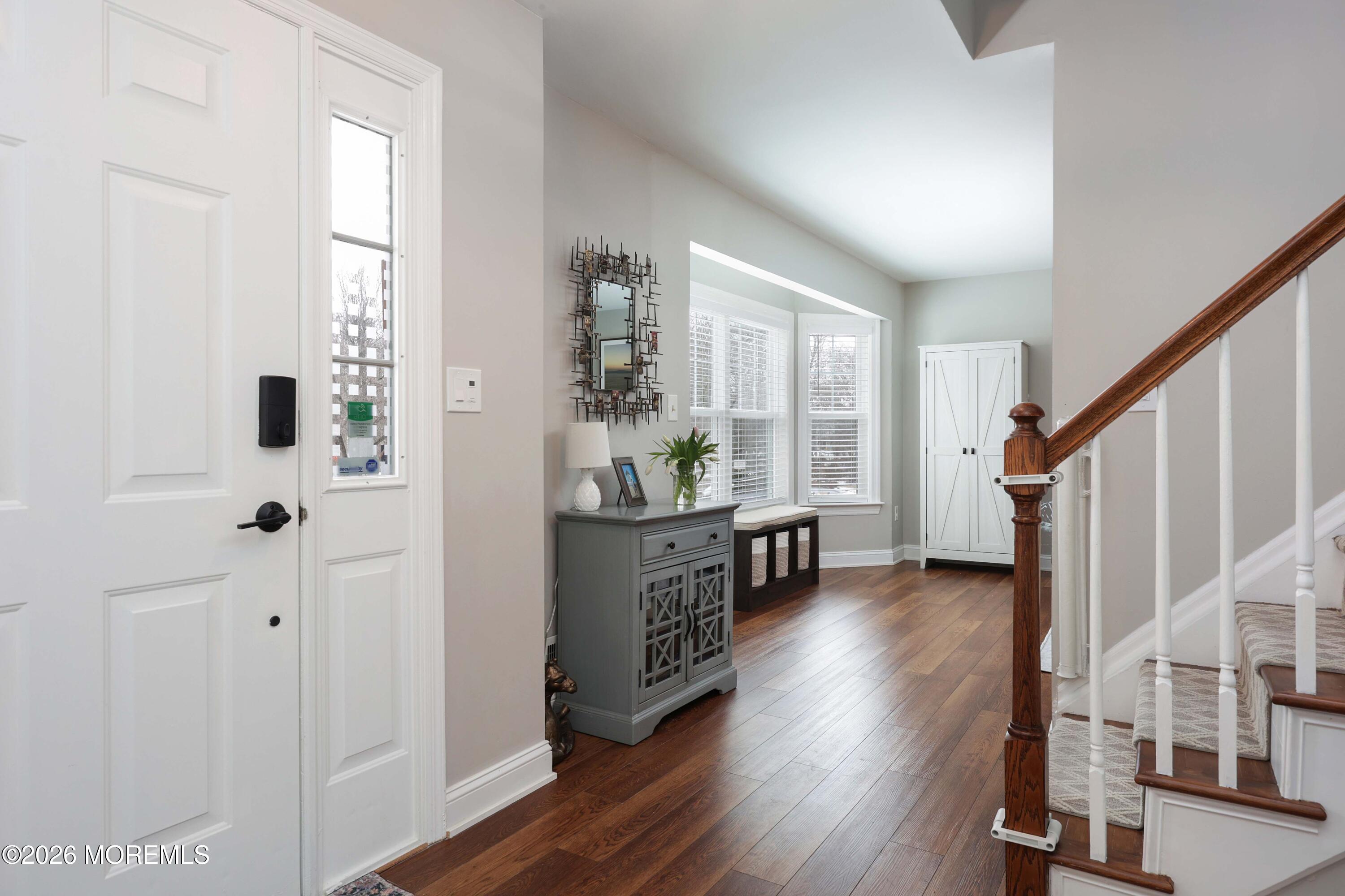 27 Jennifer Drive Howell, NJ 07731 - Photo 13 of 27 a view of an entryway with wooden floor and windows