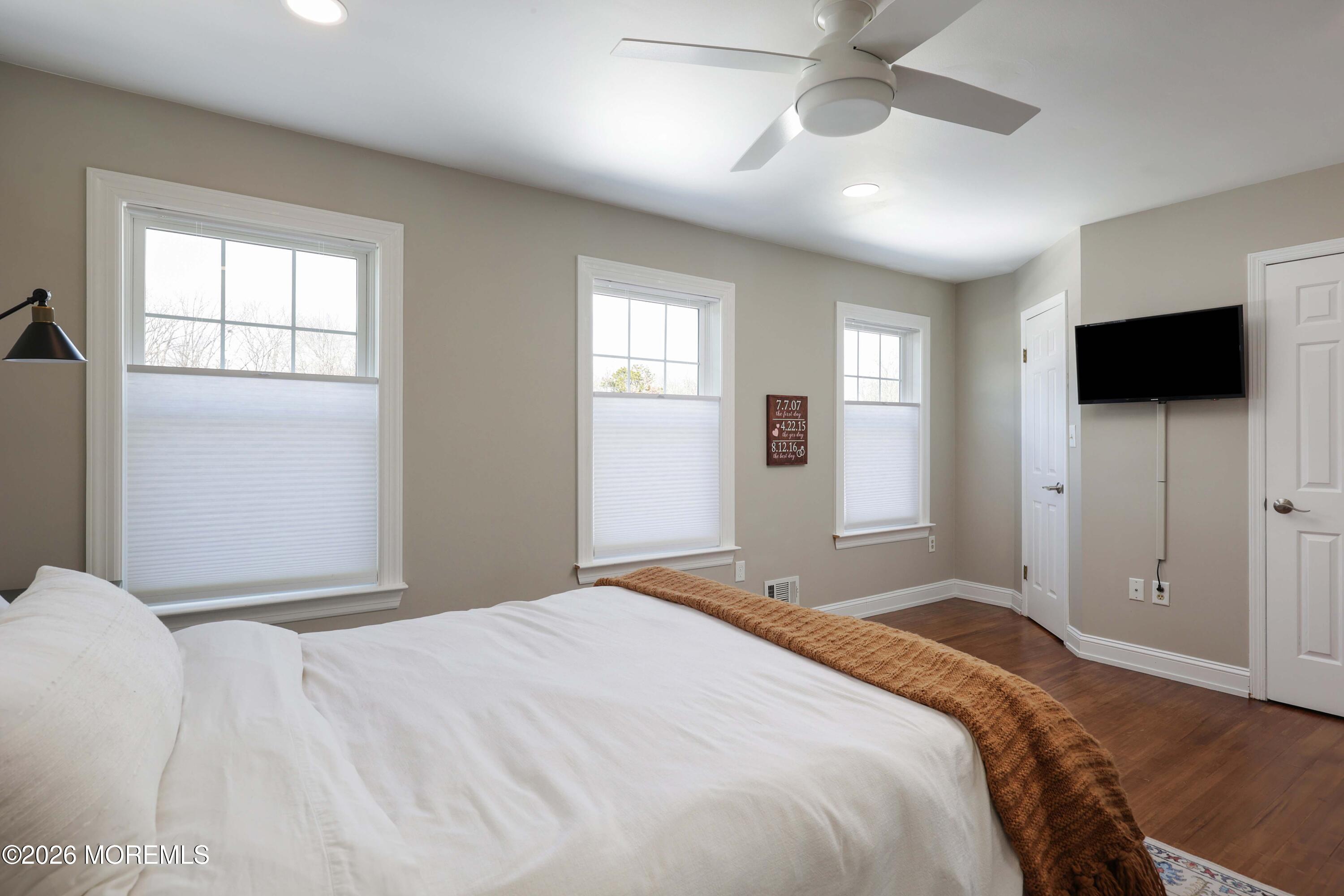 27 Jennifer Drive Howell, NJ 07731 - Photo 15 of 27 a bedroom with a bed and a flat screen tv