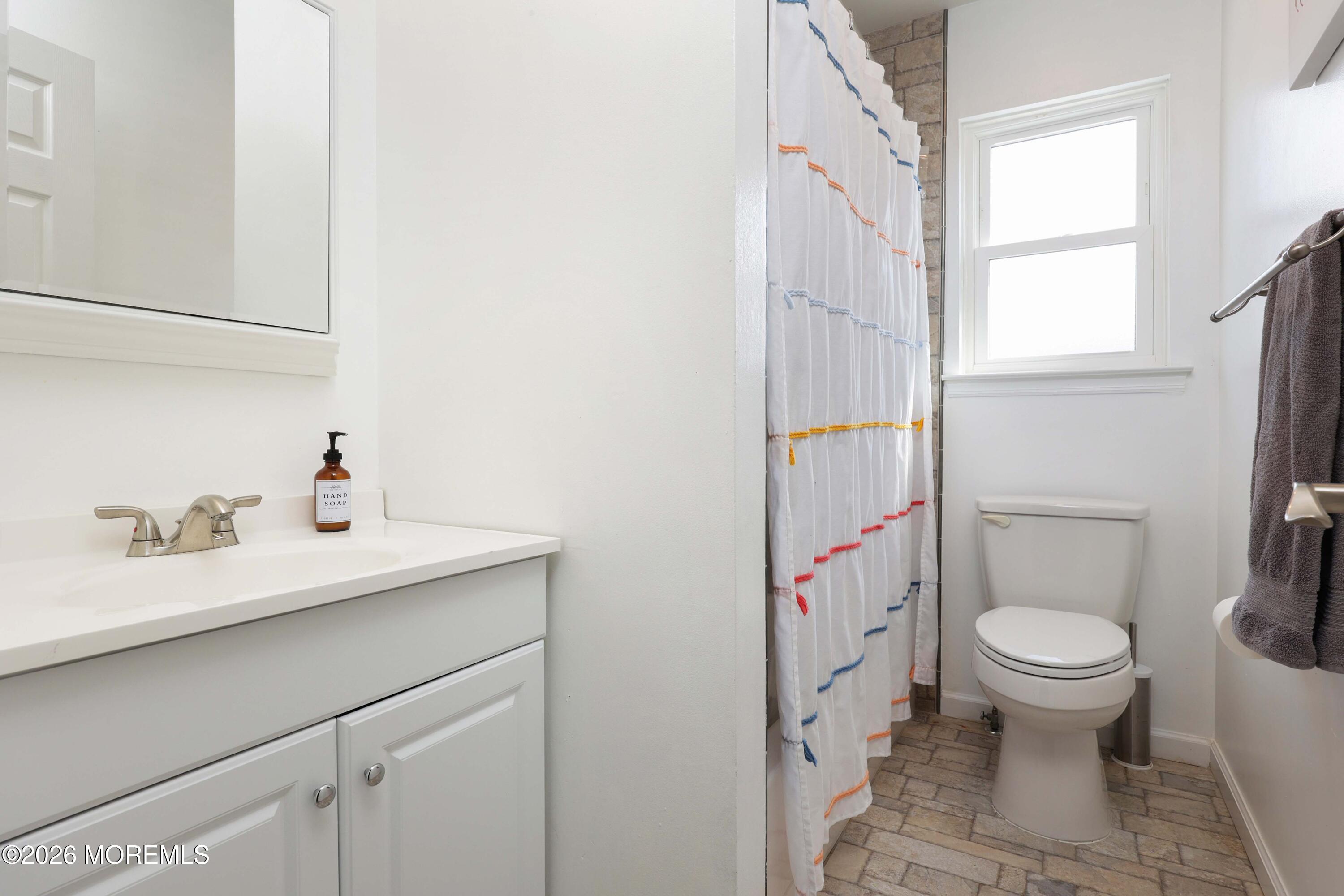 27 Jennifer Drive Howell, NJ 07731 - Photo 19 of 27 a bathroom with a sink toilet and a mirror