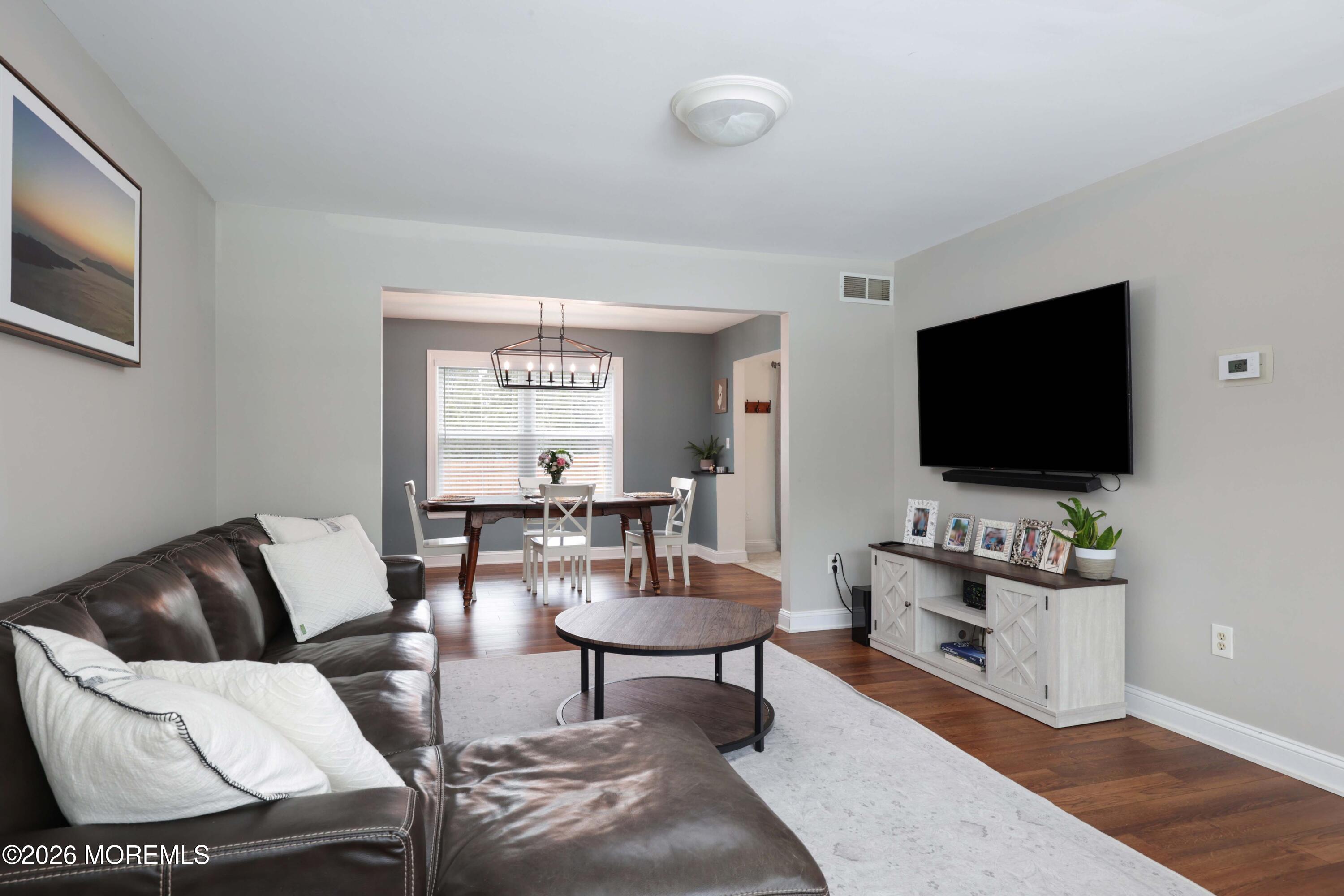 27 Jennifer Drive Howell, NJ 07731 - Photo 2 of 27 a living room with furniture and a flat screen tv