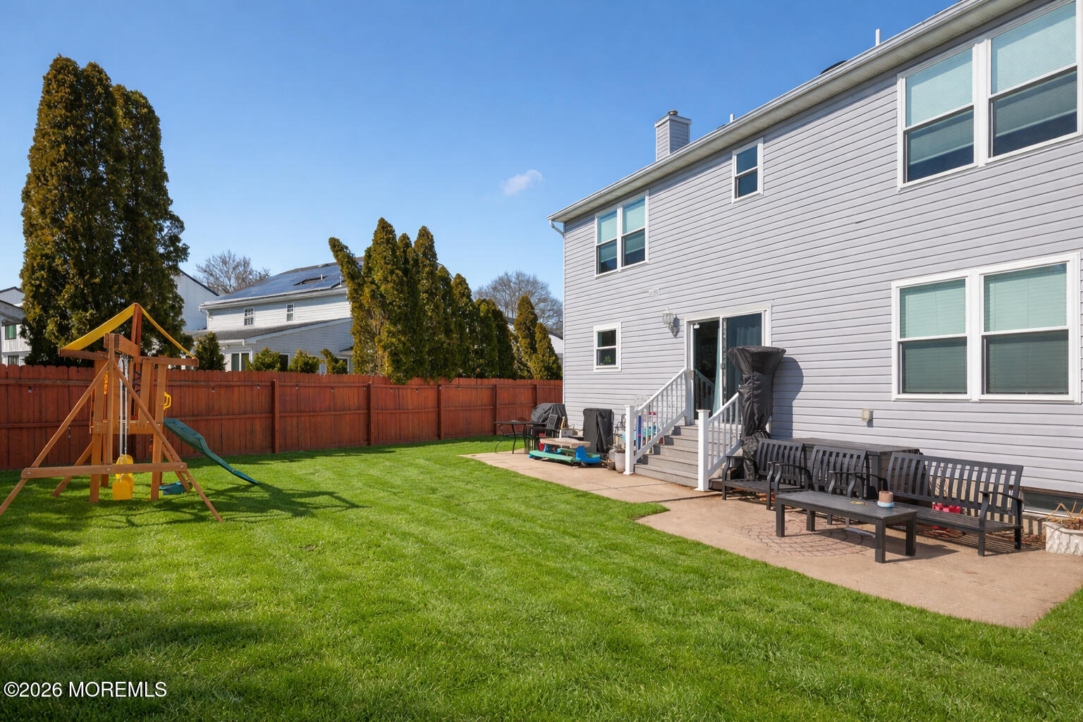 27 Jennifer Drive Howell, NJ 07731 - Photo 25 of 27 a view of a backyard with a sitting area and slide