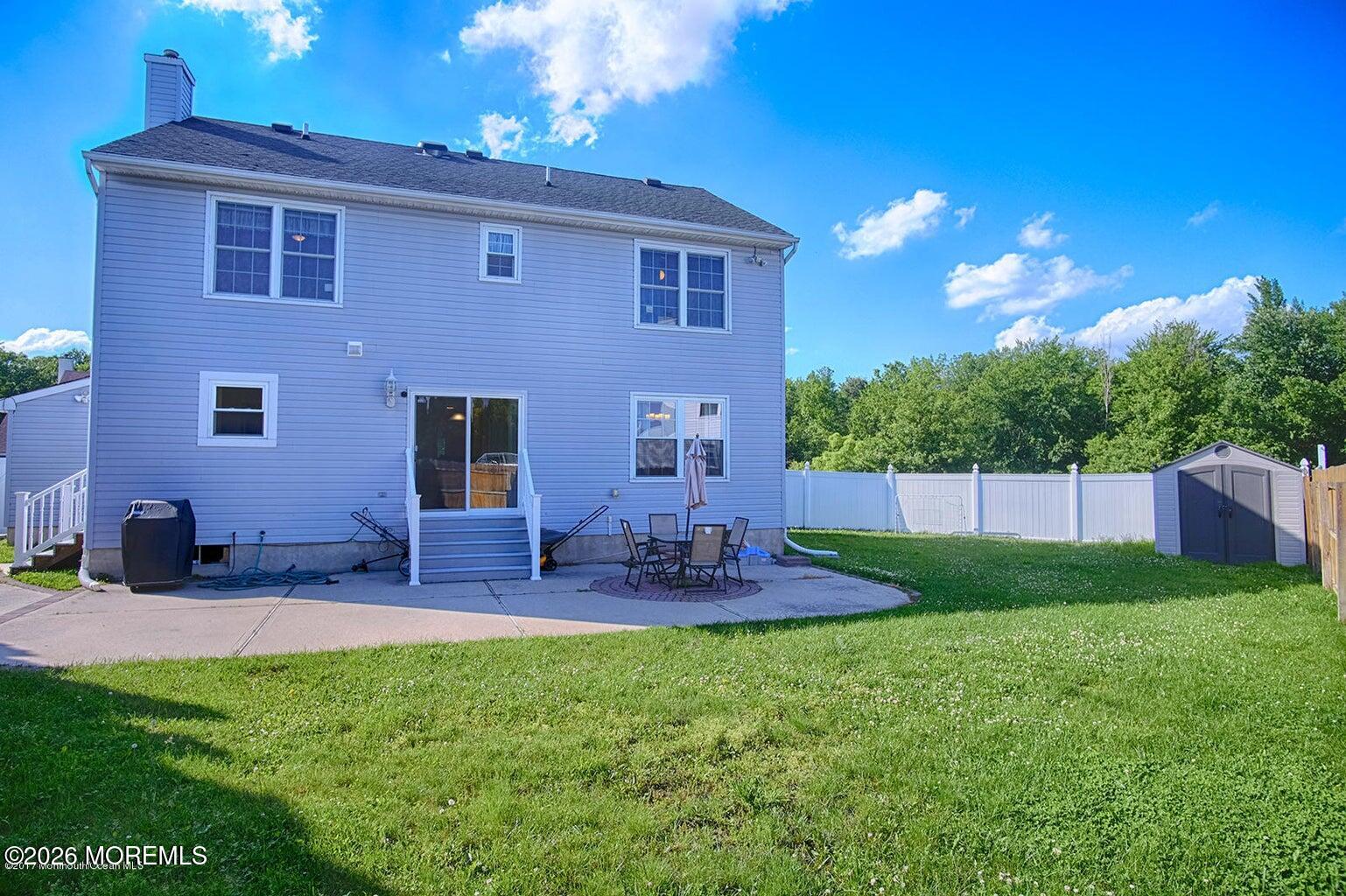 27 Jennifer Drive Howell, NJ 07731 - Photo 26 of 27 a view of backyard of house with outdoor seating and green space