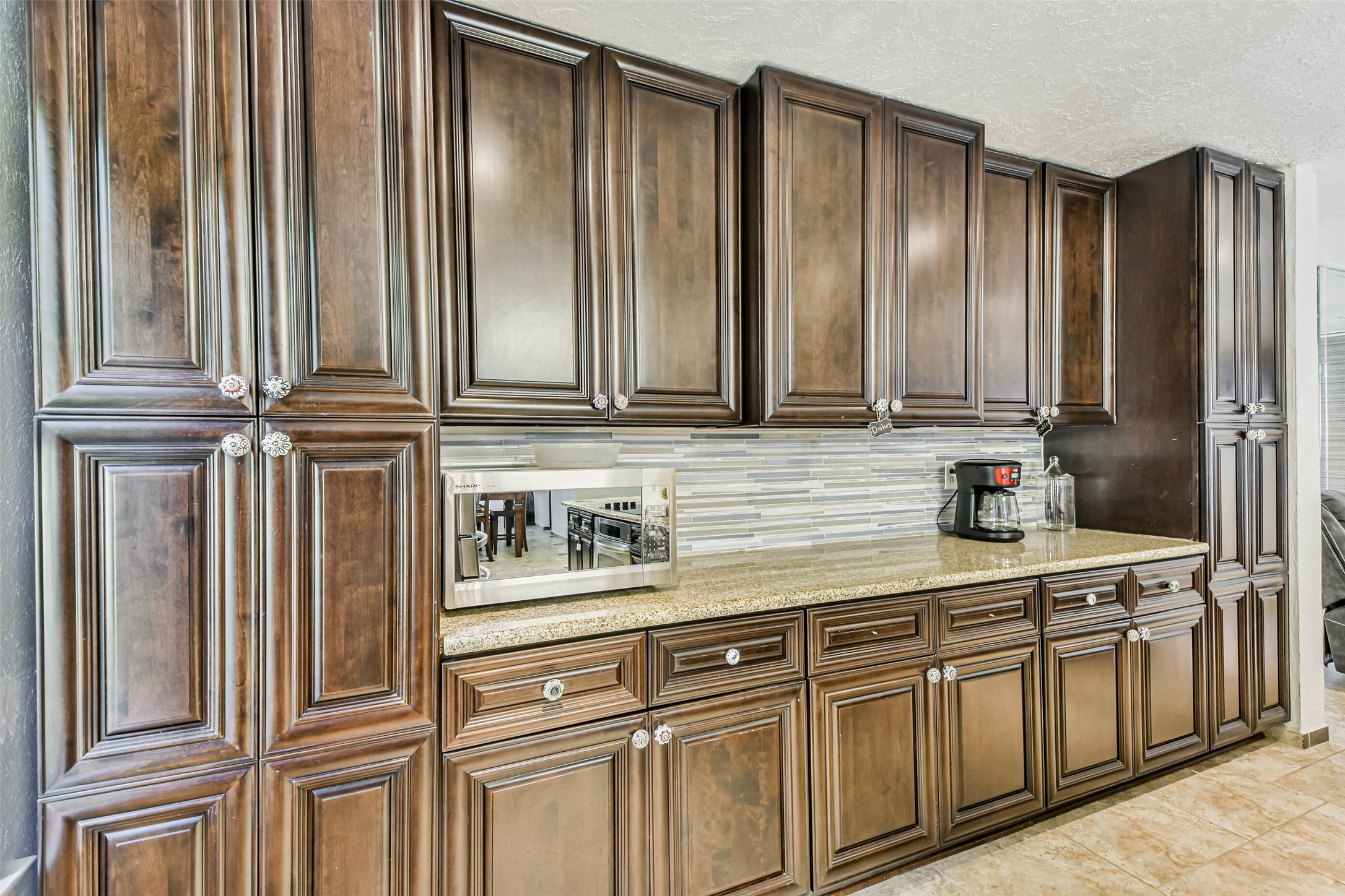 12 Coralberry Road Spring, TX 77381 - Photo 12 of 45 a kitchen with stainless steel appliances granite countertop white cabinets and a sink