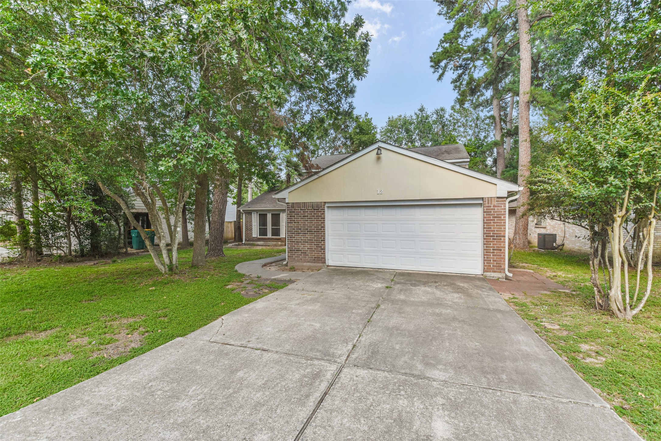 12 Coralberry Road Spring, TX 77381 - Photo 2 of 45 a view of a house with a yard and large trees