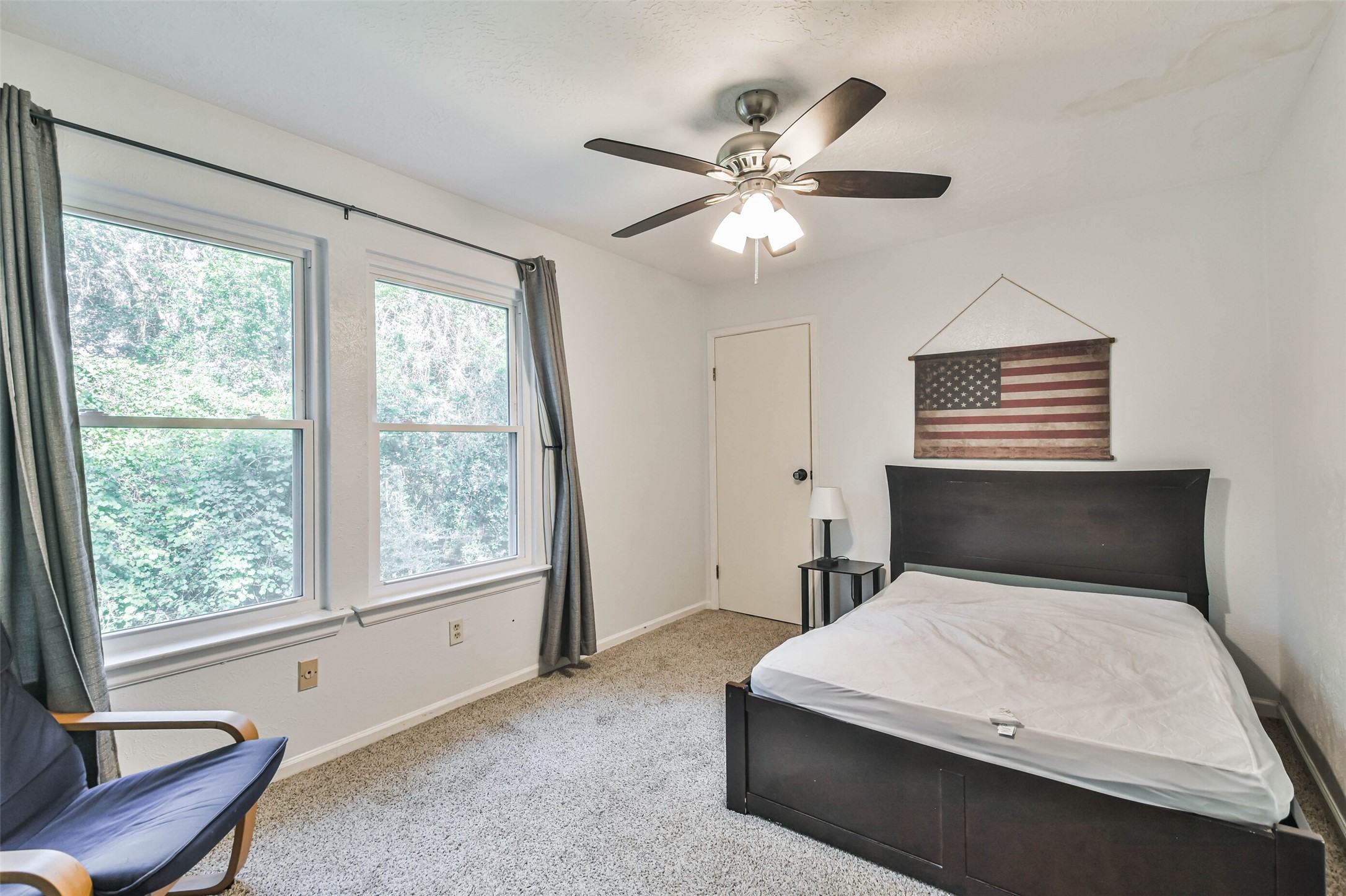 12 Coralberry Road Spring, TX 77381 - Photo 25 of 45 a bedroom with a large bed and a window