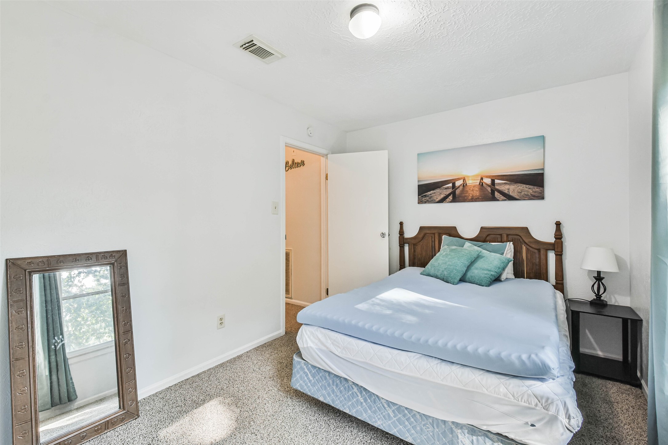 12 Coralberry Road Spring, TX 77381 - Photo 29 of 45 a bedroom with a bed and a window