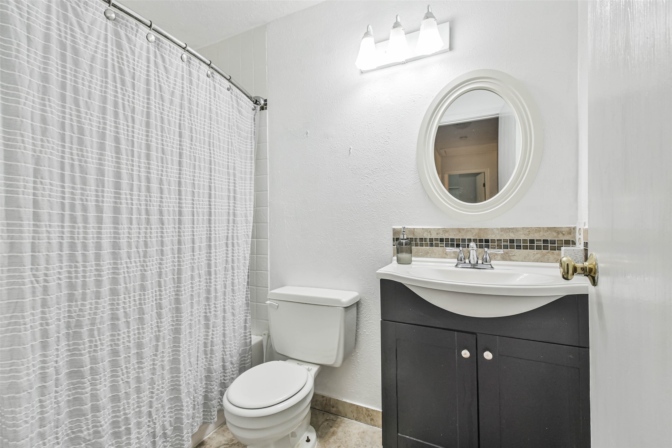 12 Coralberry Road Spring, TX 77381 - Photo 30 of 45 a bathroom with a sink a toilet and a mirror