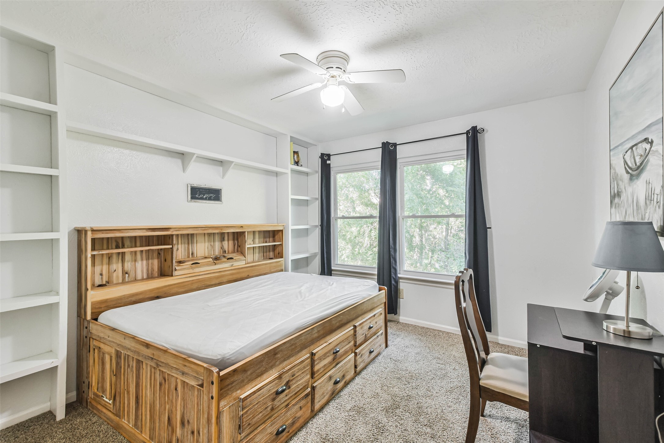 12 Coralberry Road Spring, TX 77381 - Photo 31 of 45 a bedroom with a bed and a table in it