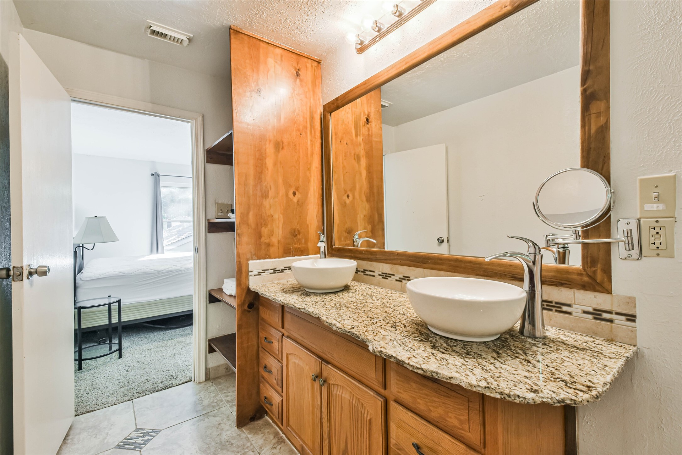 12 Coralberry Road Spring, TX 77381 - Photo 37 of 45 a en suite bathroom with a granite countertop tub and a sink
