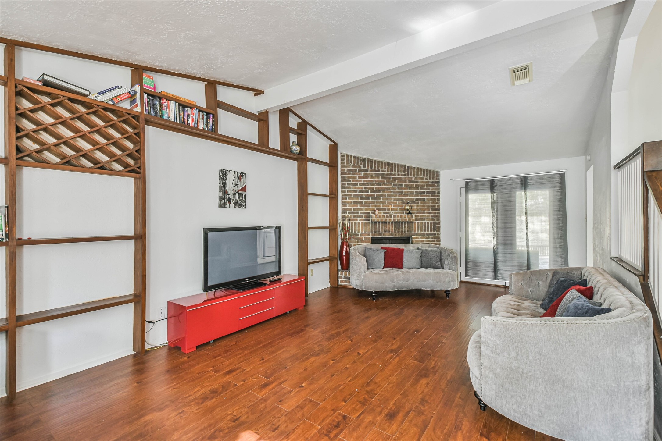 12 Coralberry Road Spring, TX 77381 - Photo 39 of 45 a living room with furniture and a fireplace
