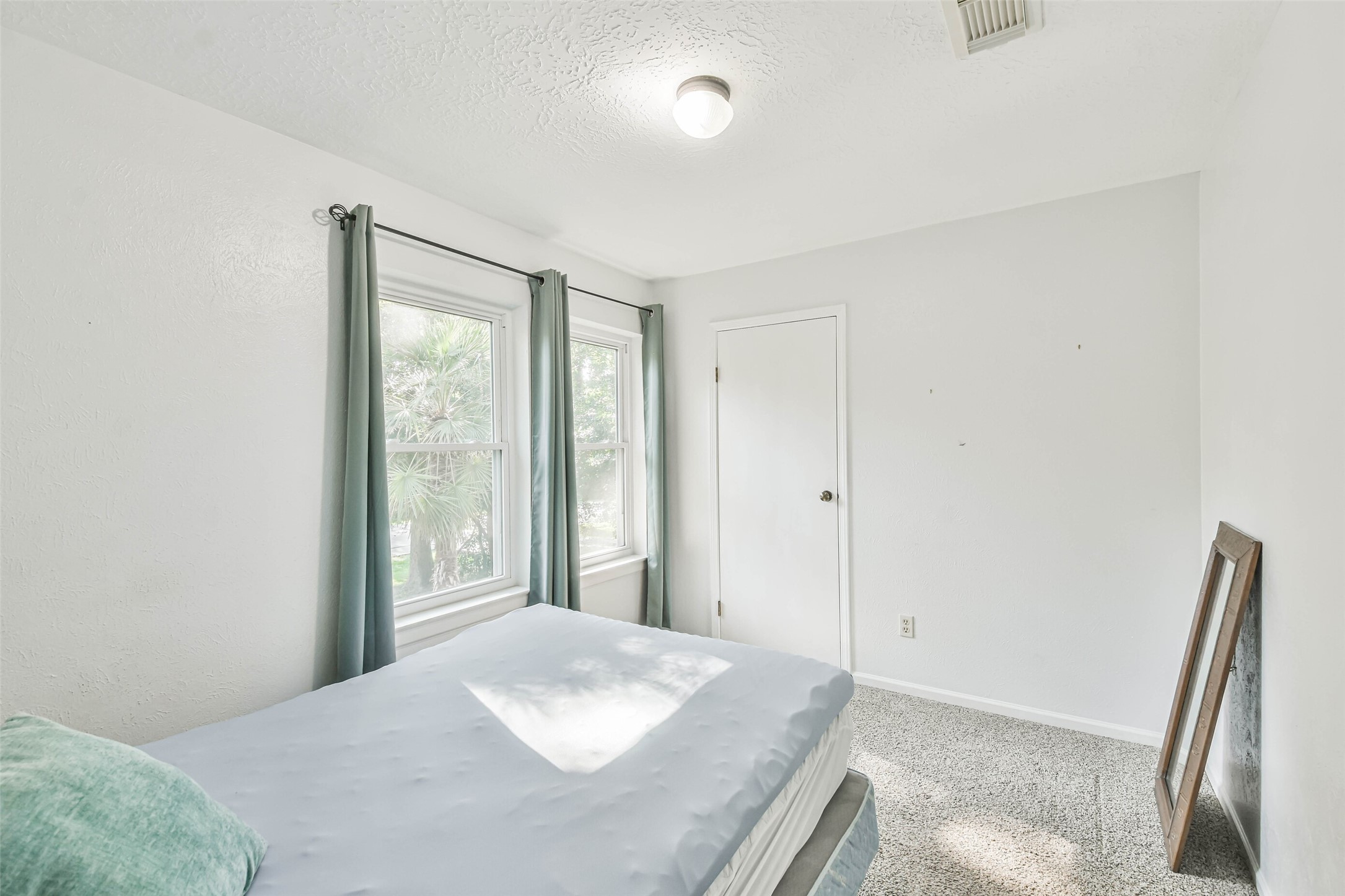 12 Coralberry Road Spring, TX 77381 - Photo 40 of 45 a bedroom with a bed and a large window