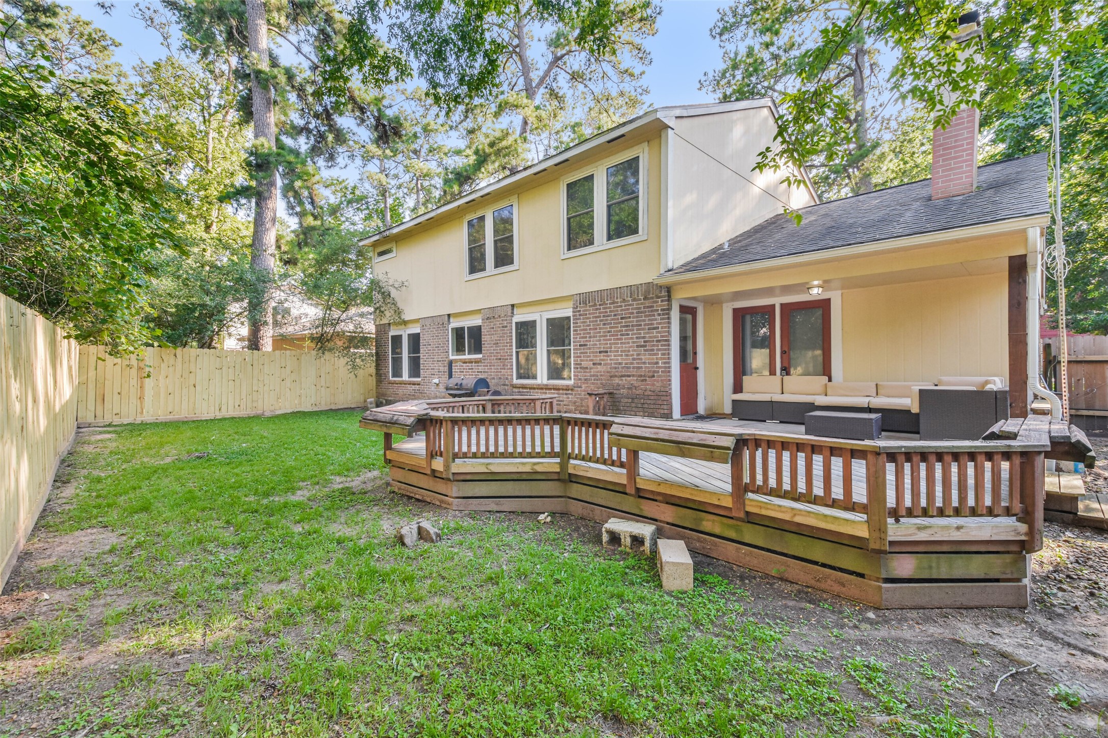 12 Coralberry Road Spring, TX 77381 - Photo 43 of 45 a wooden bench sitting in front of a house