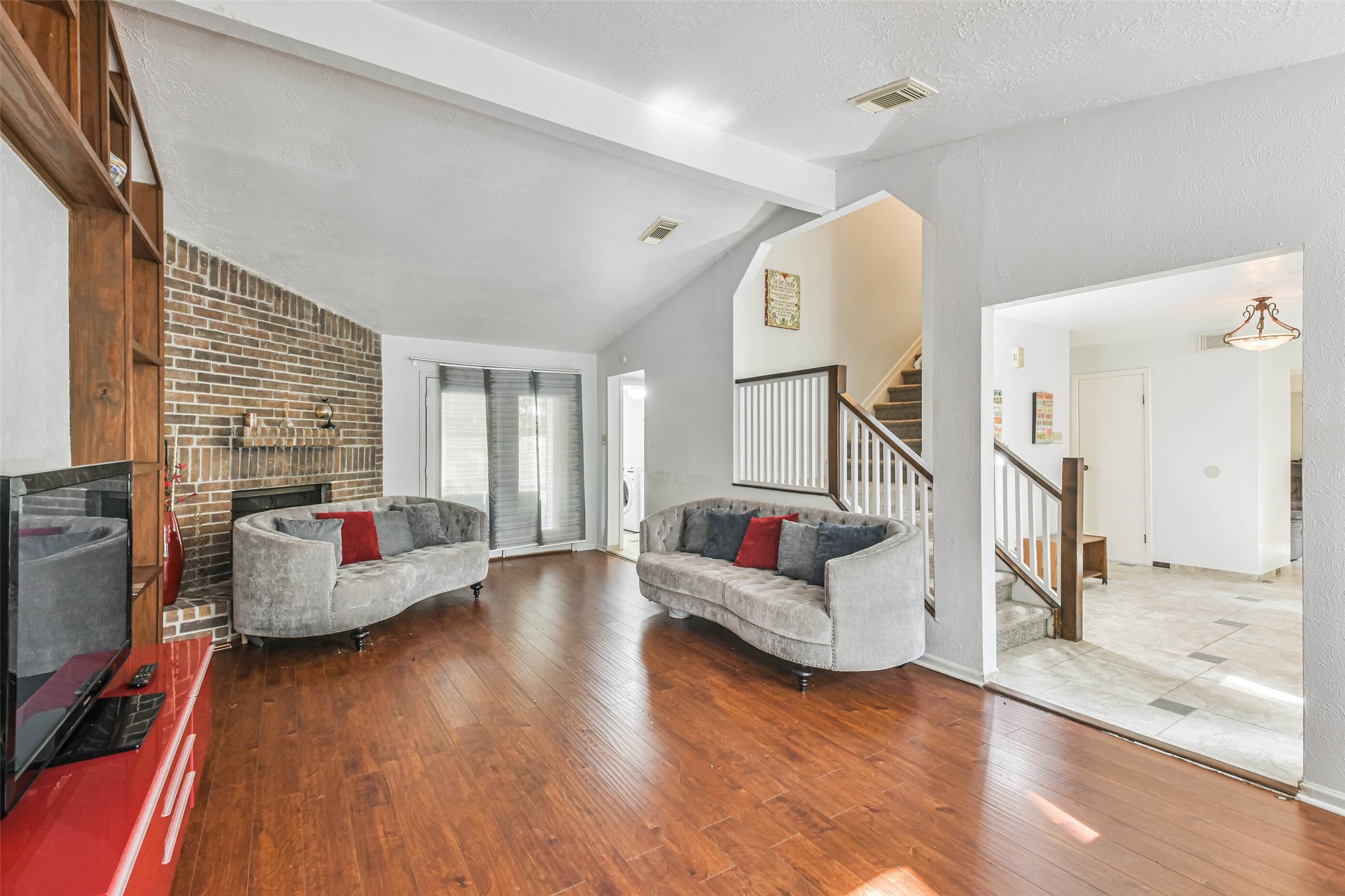 12 Coralberry Road Spring, TX 77381 - Photo 6 of 45 a living room with fireplace furniture and a wooden floor