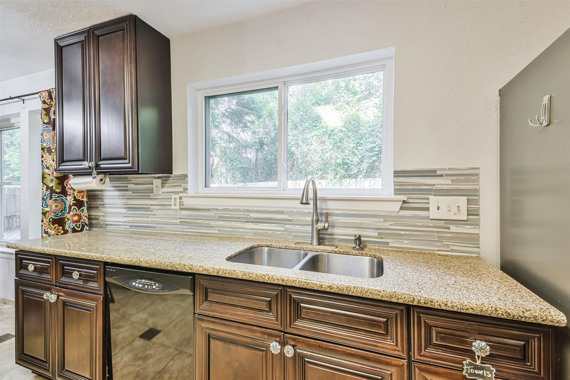 12 Coralberry Road Spring, TX 77381 - Photo 9 of 45 a kitchen with stainless steel appliances granite countertop a sink and a window