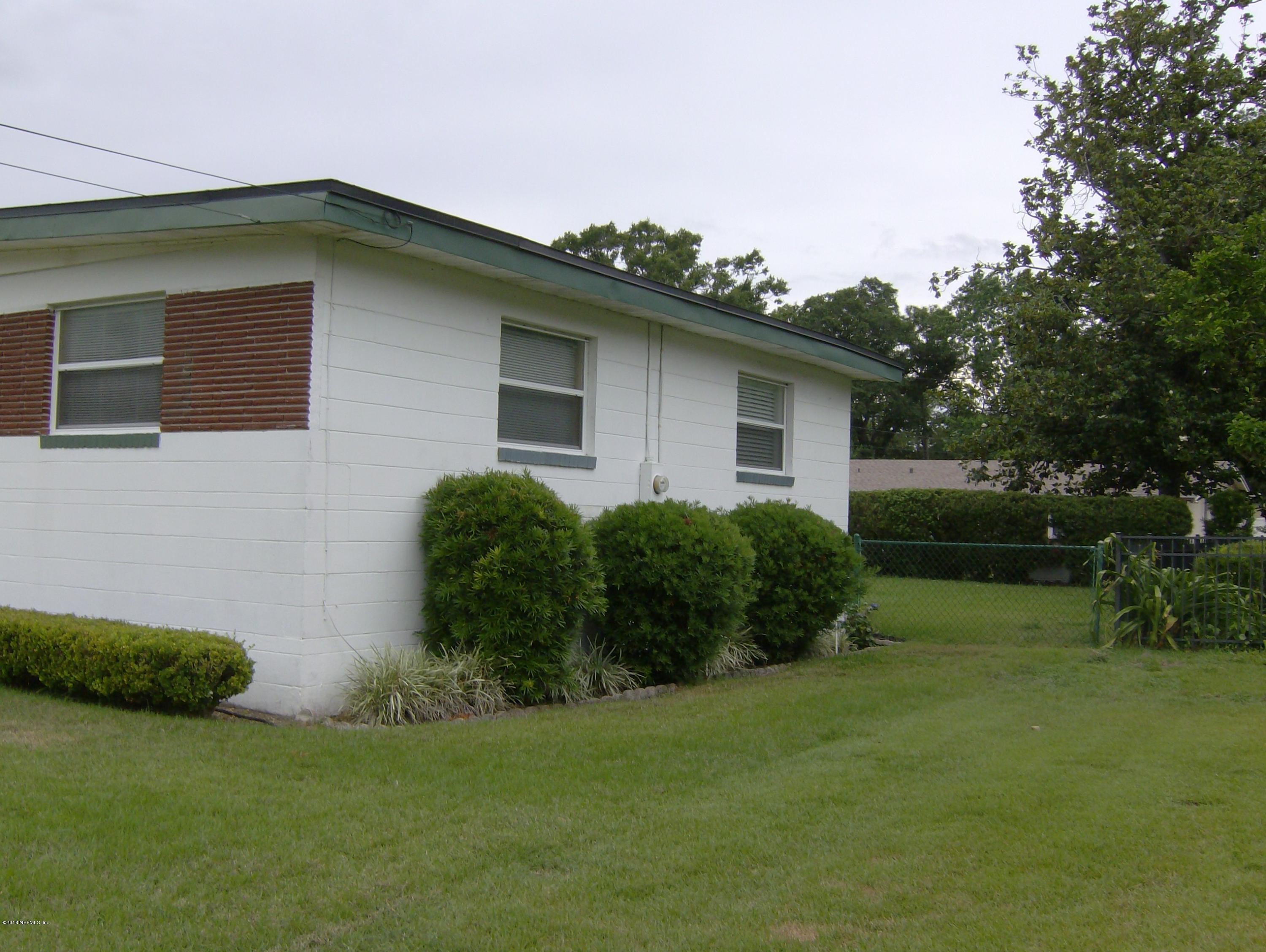 3746 Bess Road Jacksonville, FL 32277 - Photo 2 of 31 a house that has a tree in front of it