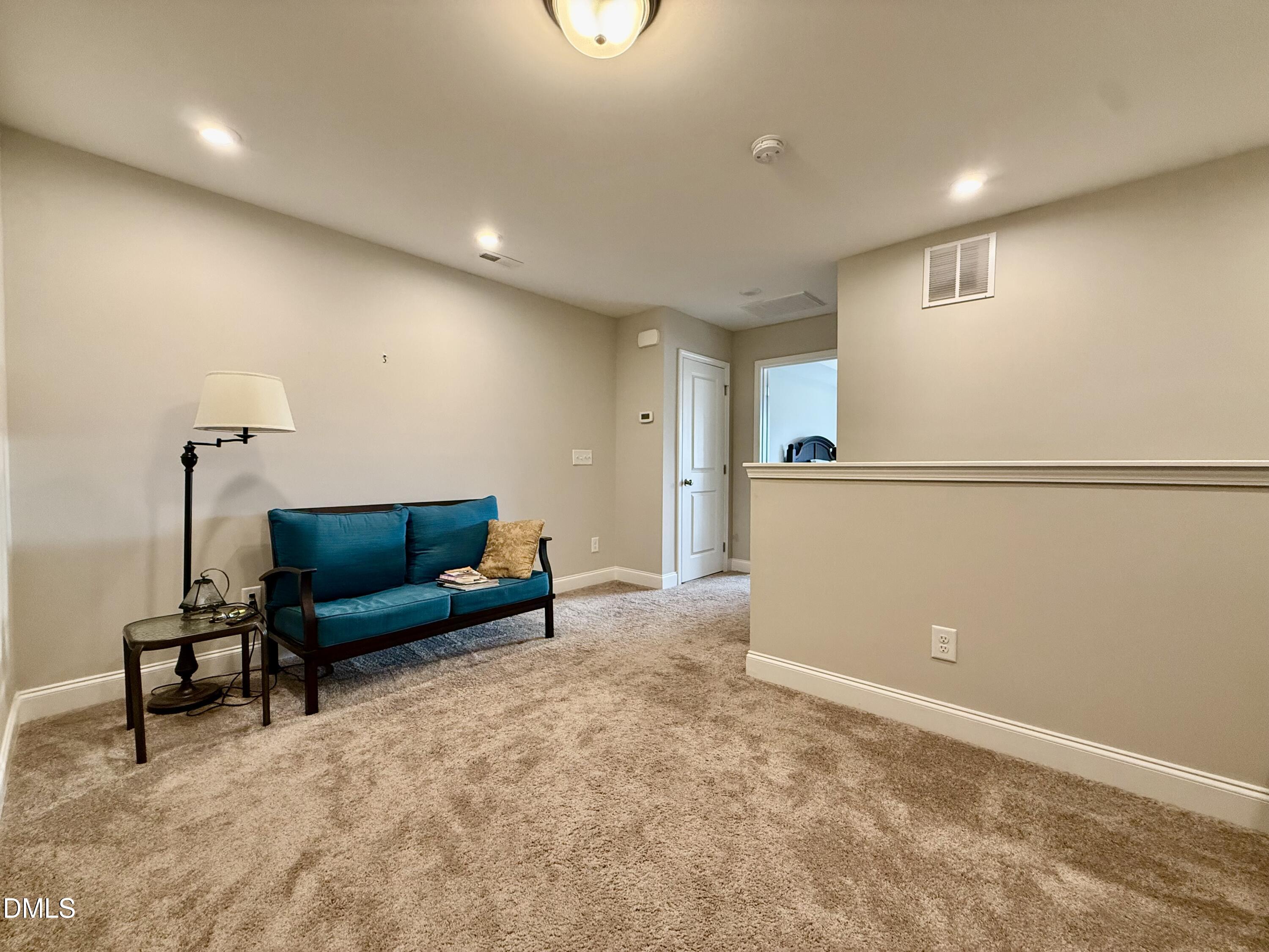 254 Deardom Way Chapel Hill, NC 27516 - Photo 14 of 21 a living room with furniture and a wooden floor