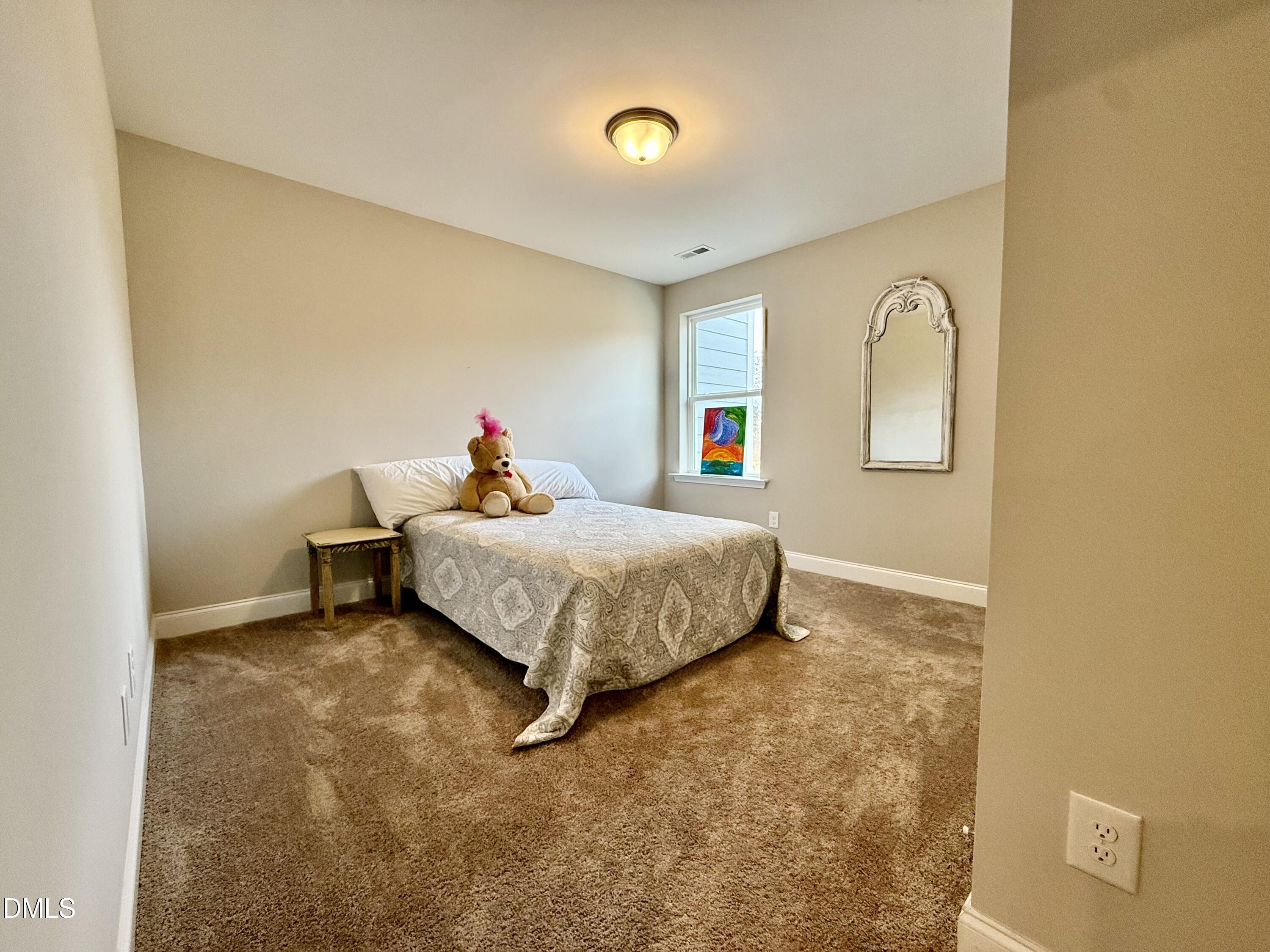 254 Deardom Way Chapel Hill, NC 27516 - Photo 16 of 21 a bed room with a bed and a window