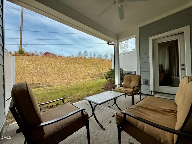 a view of a balcony with chairs