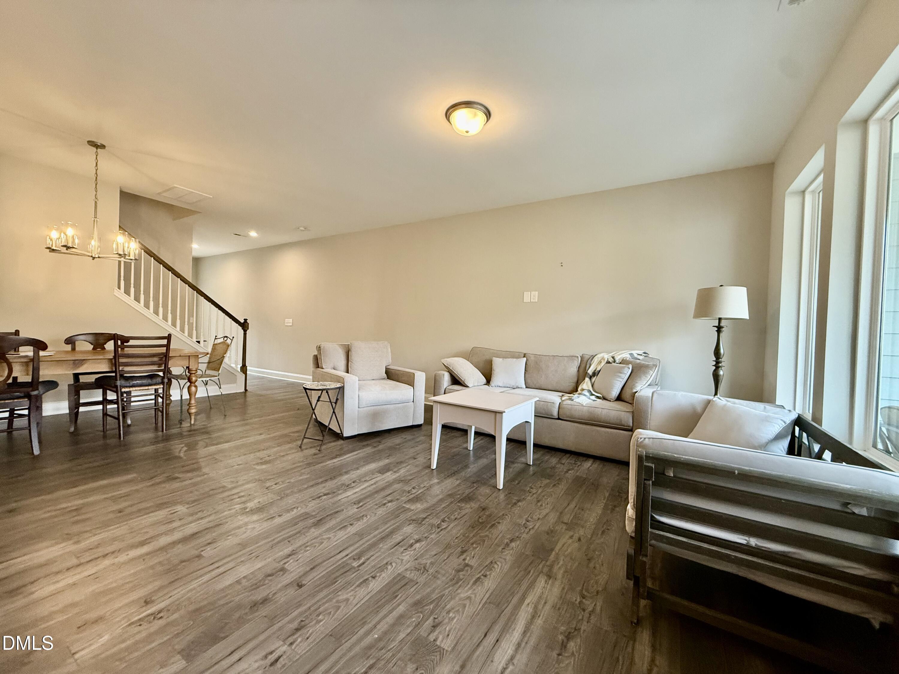 254 Deardom Way Chapel Hill, NC 27516 - Photo 3 of 21 a living room with furniture and wooden floor