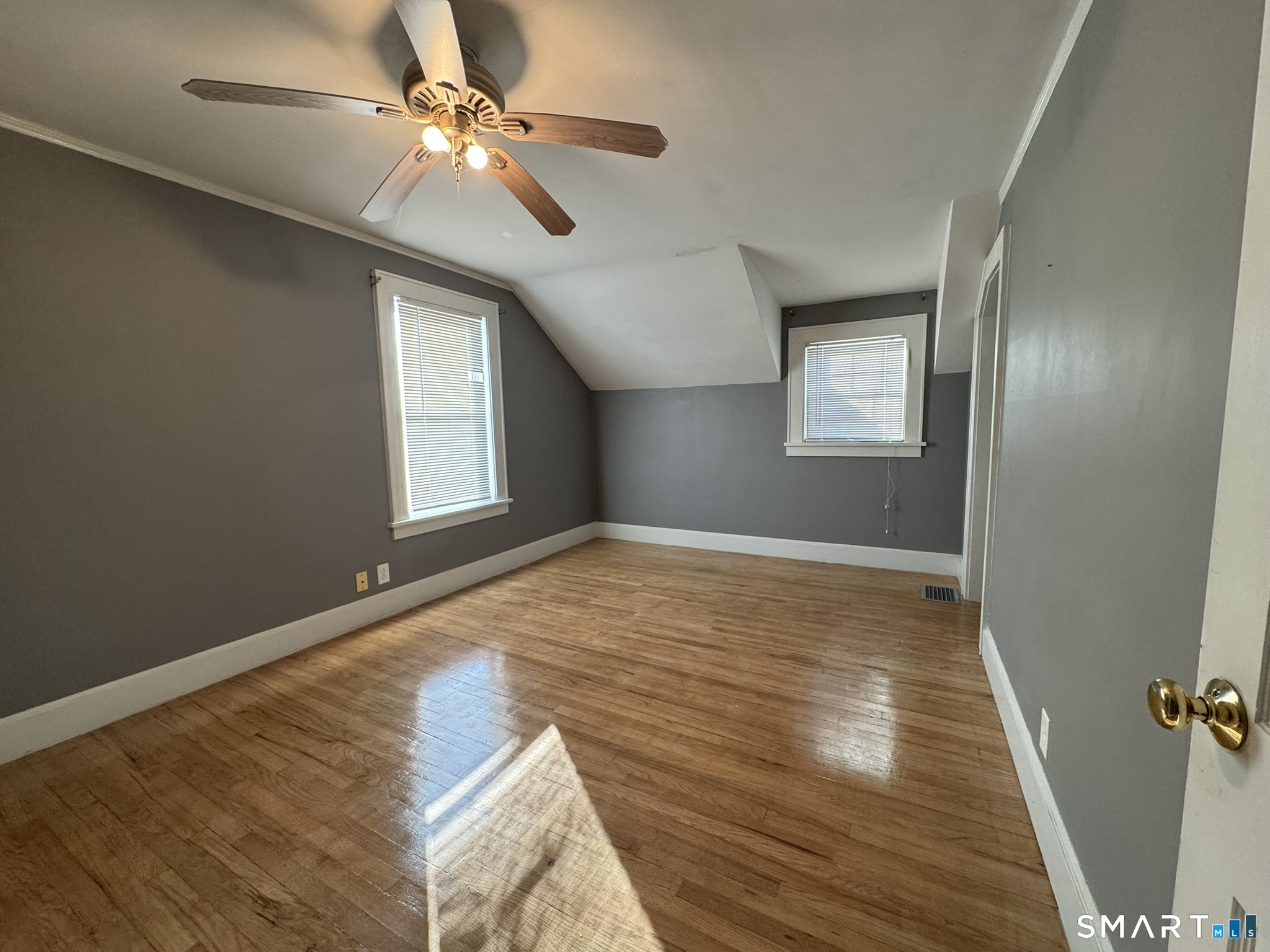 310 Lestertown Road Groton, CT 06340 - Photo 25 of 31 a view of empty room with wooden floor and fan