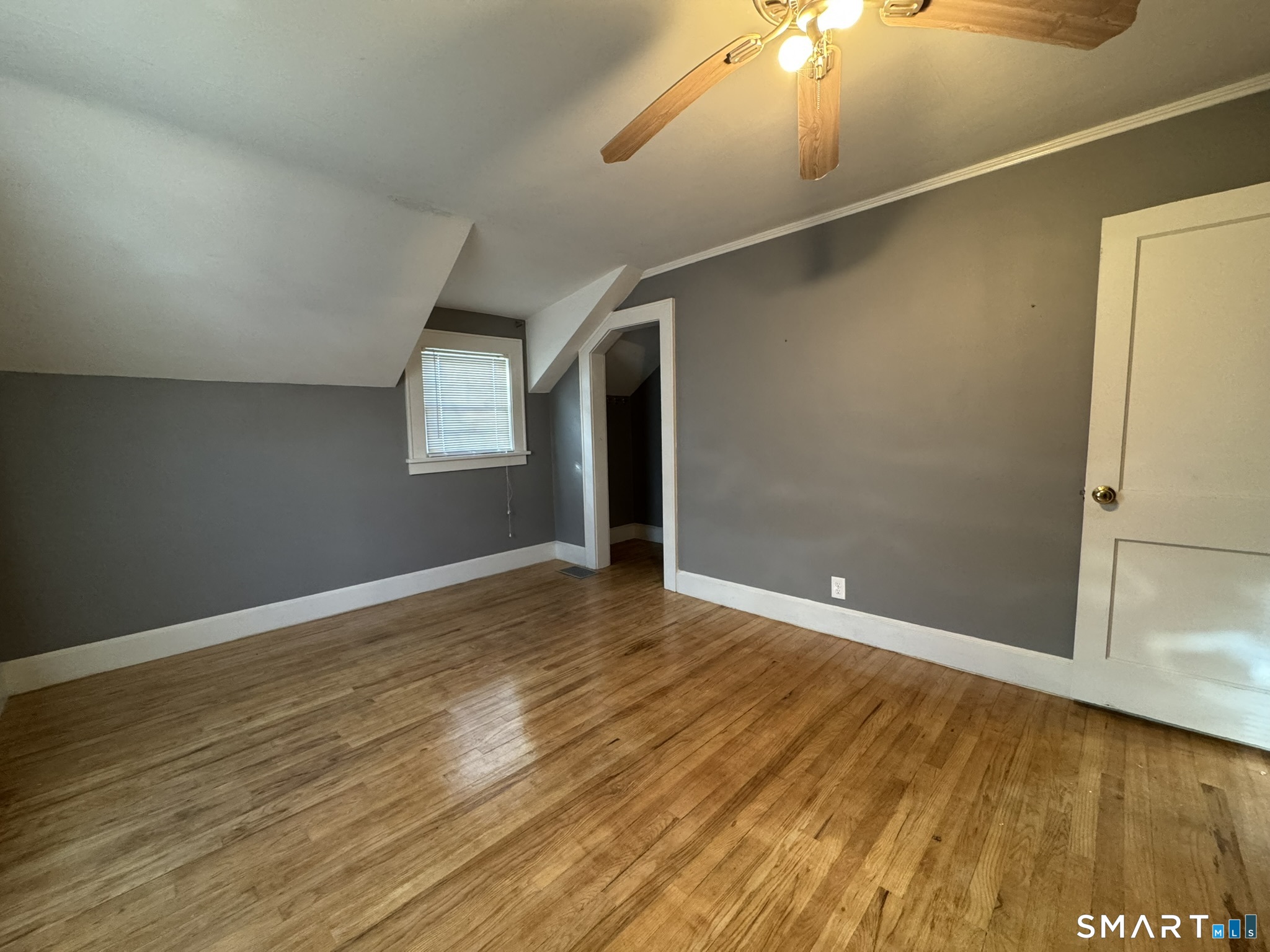 310 Lestertown Road Groton, CT 06340 - Photo 26 of 31 an empty room with wooden floor and windows