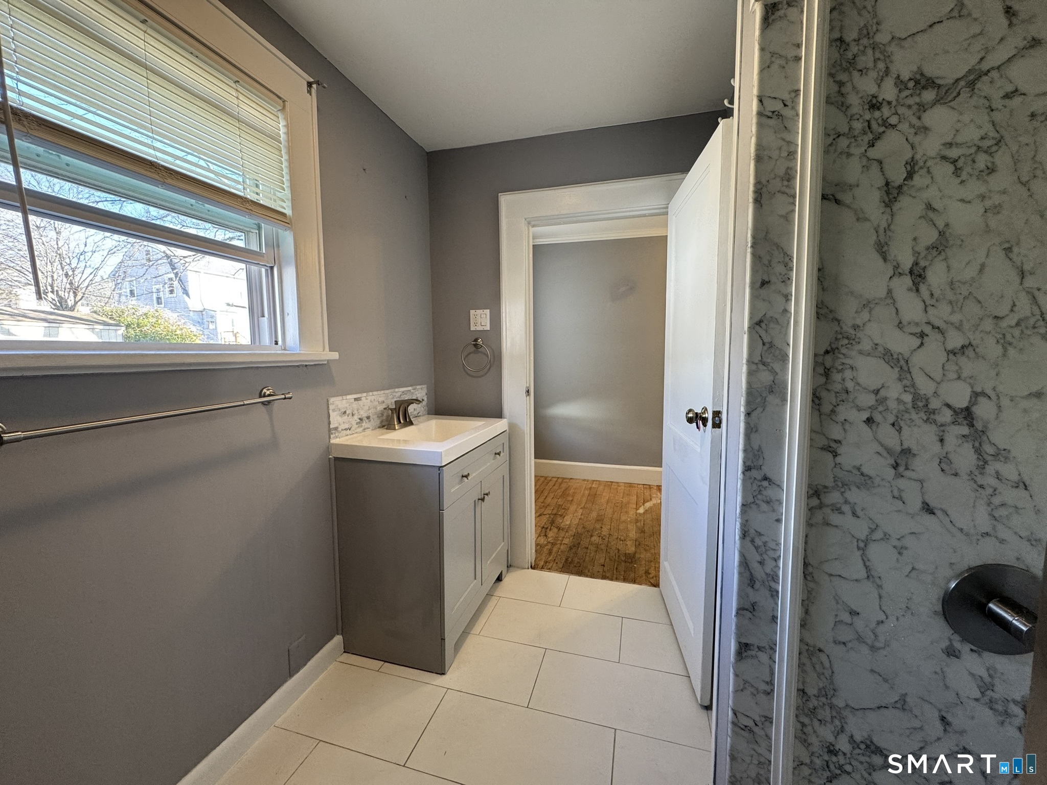 310 Lestertown Road Groton, CT 06340 - Photo 28 of 31 a bathroom with a sink and a mirror