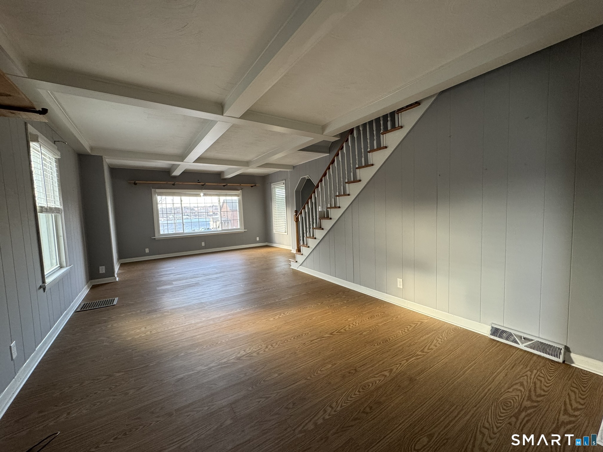 310 Lestertown Road Groton, CT 06340 - Photo 8 of 31 a view of an empty room with wooden floor and a window