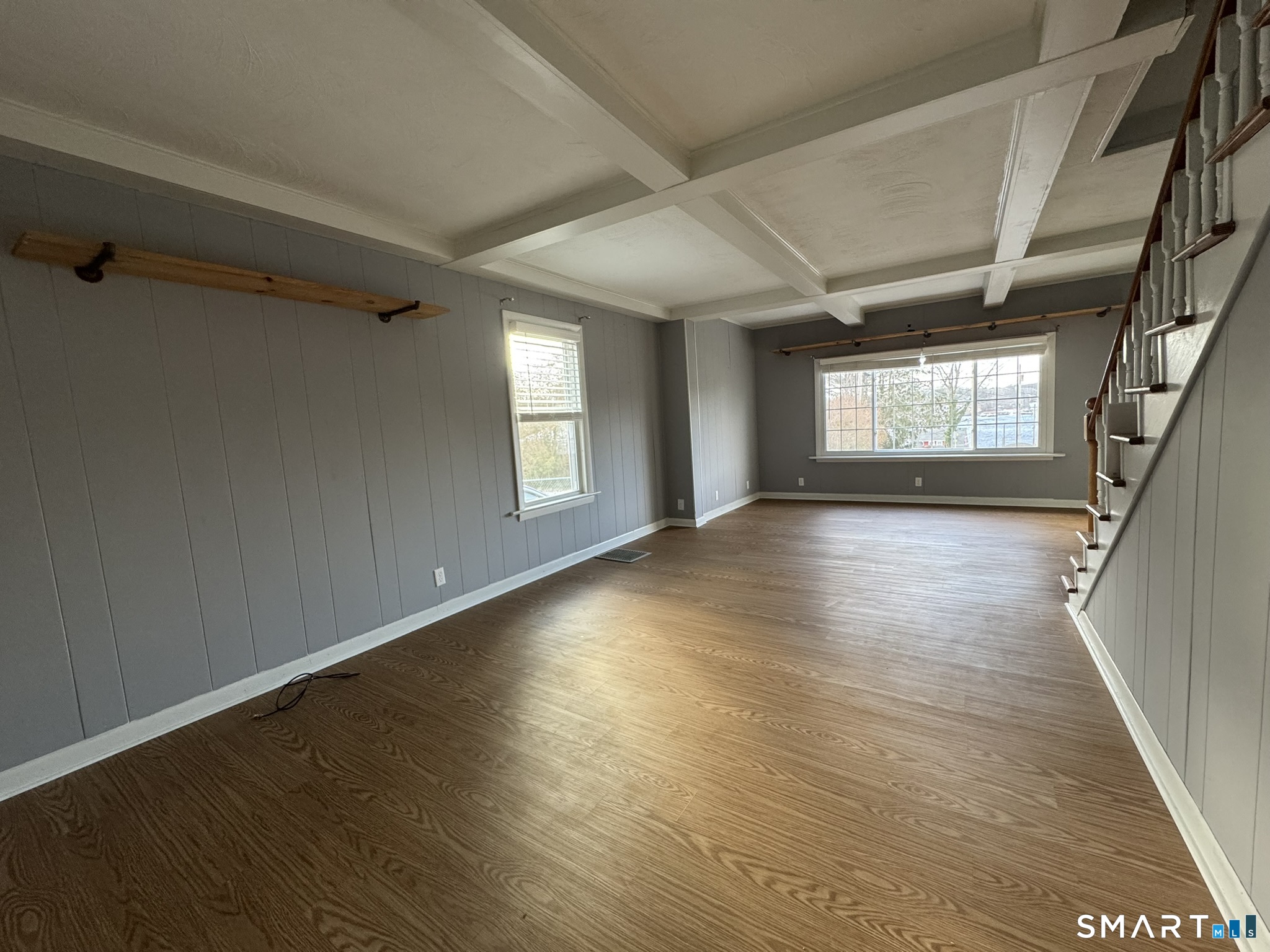 310 Lestertown Road Groton, CT 06340 - Photo 9 of 31 a view of an empty room with wooden floor and a window