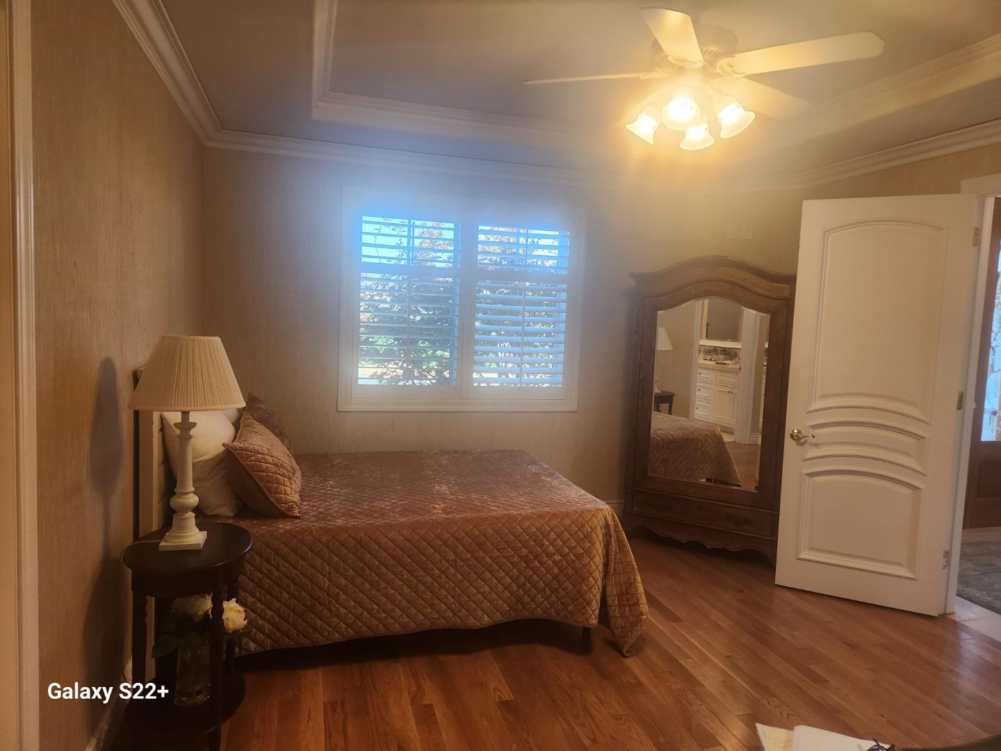 1186 Third Street Monterey, CA 93940 - Photo 14 of 24 a bedroom with a bed and wooden floor