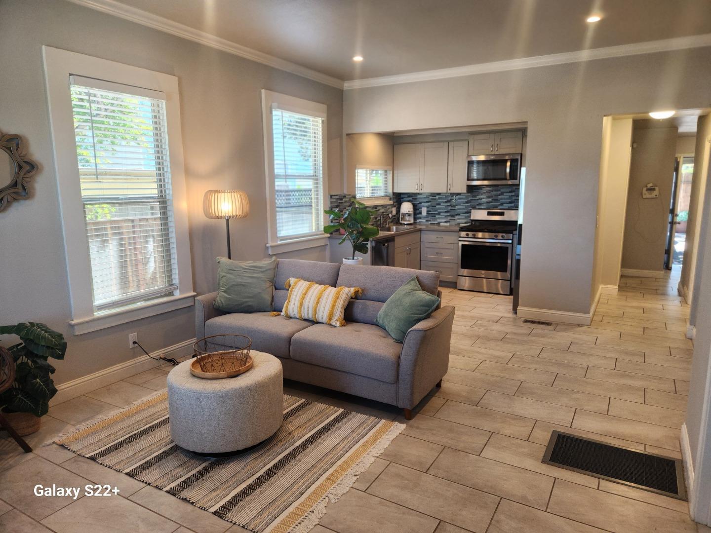 1186 Third Street Monterey, CA 93940 - Photo 3 of 24 a living room with furniture a window and a kitchen view