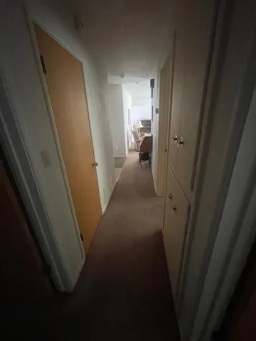 a view of hallway with a mirror