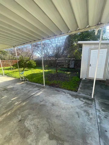 a view of a backyard with hardwood