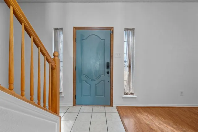 a view of an entryway with wooden floor