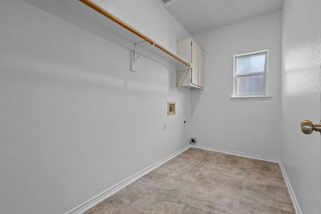 a view of storage and utility room with empty racks