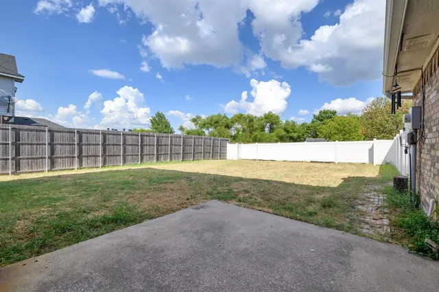 a view of a field with a big yard